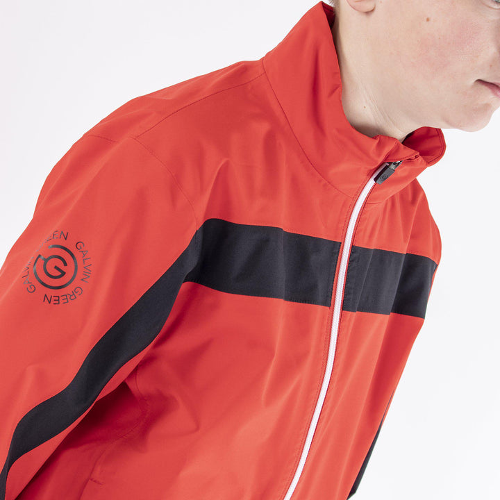 Robert is a Waterproof golf jacket for Juniors in the color Red(2)