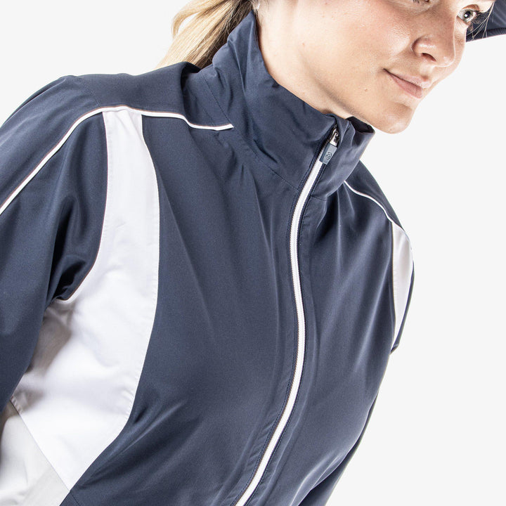 Ally is a Waterproof golf jacket for Women in the color Navy/Cool Grey/White(3)